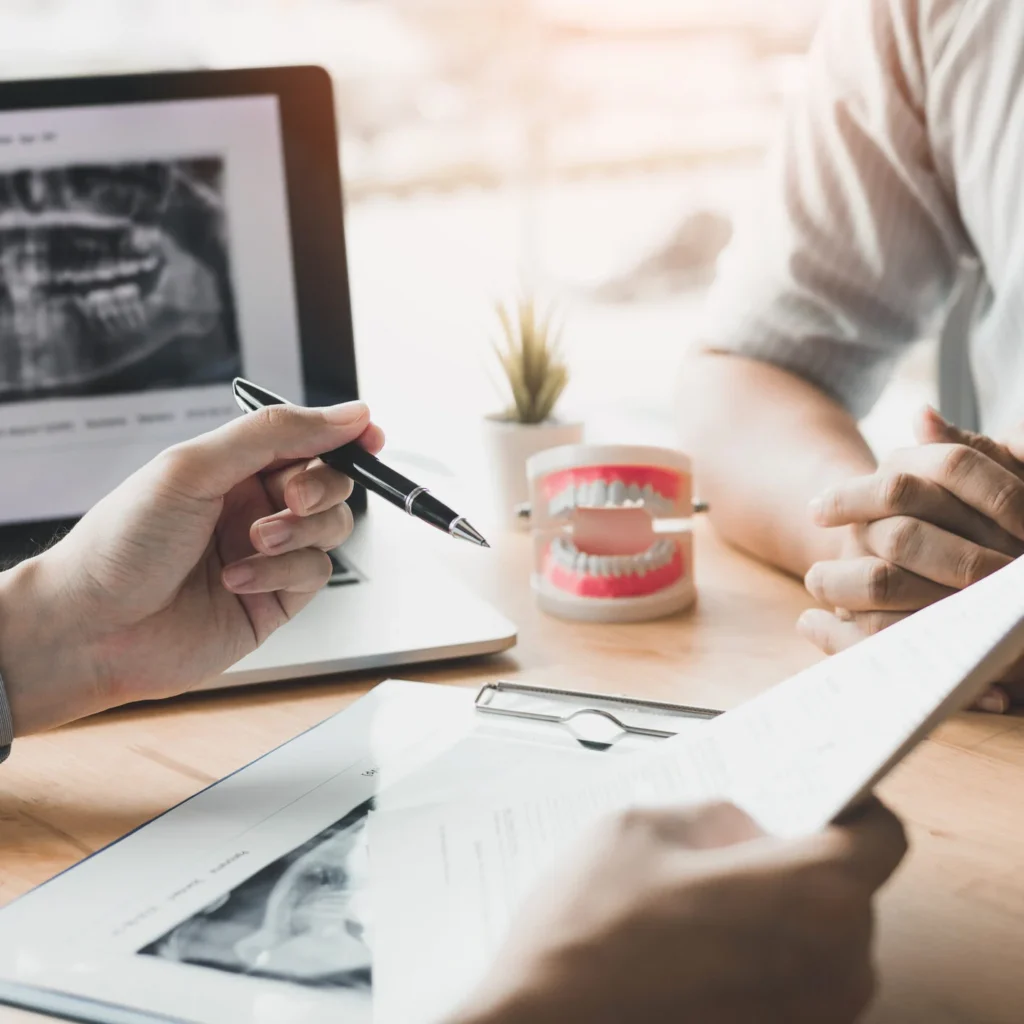 Dentist discussing financing with patient
